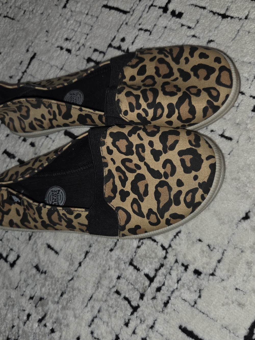 Rocket Dog leopard print slip-on canvas shoes.